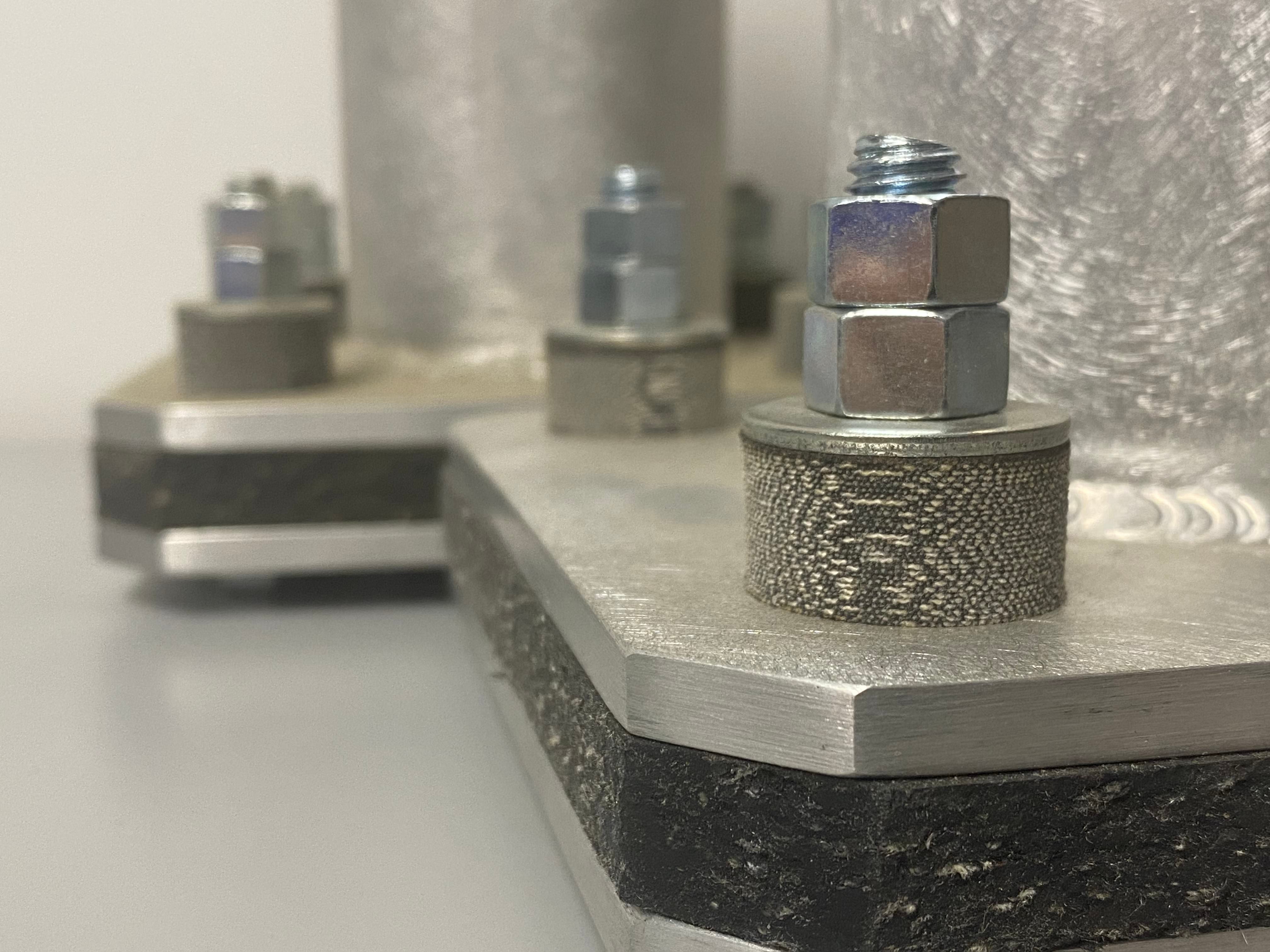 SA-47 with Fabreeka bushings in a typical steel connection.